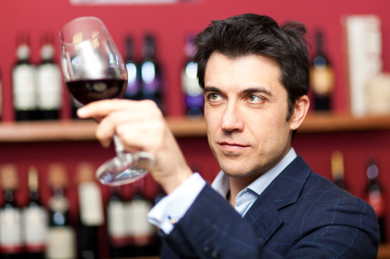 Man tasting red wine
