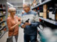 Couple buying wine in a grocery store