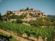 Picturesque Tuscan Landscape with medieval town and vineyards